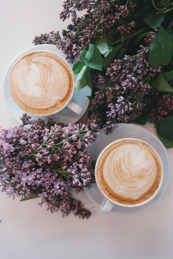 pexels-photo-377903-377903 Artistic latte art surrounded by blooming lilac flowers creates a cozy, aesthetic vibe.